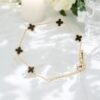 Elegant Clover Charm Minimal Bracelet – Black & Gold
