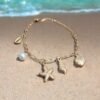 Sea Charm Gold Bracelet – Starfish, Shell & Pearl